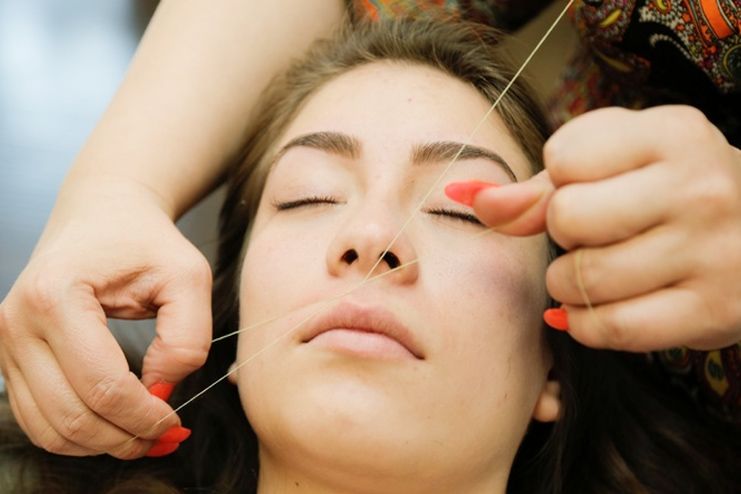 Threading to remove upper lip hair