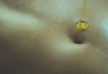 Applying Pure Ghee on the Navel Before Bed: Ayurvedic Benefits and Modern Perspective Applying Pure Ghee on the Navel Before Bed