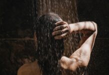 Why Showering in the Dark Might Be the Sleep Trick You’ve Been Missing Why Showering in the Dark Might Be the Sleep Trick Youve Been Missing
